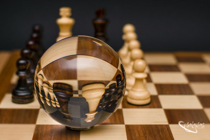 Chess peaces trough a lens ball