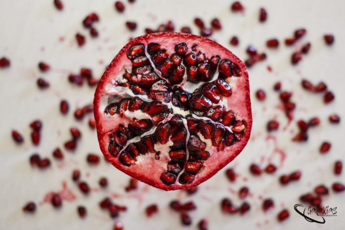 Flat Lay view of a opened pomegranate.